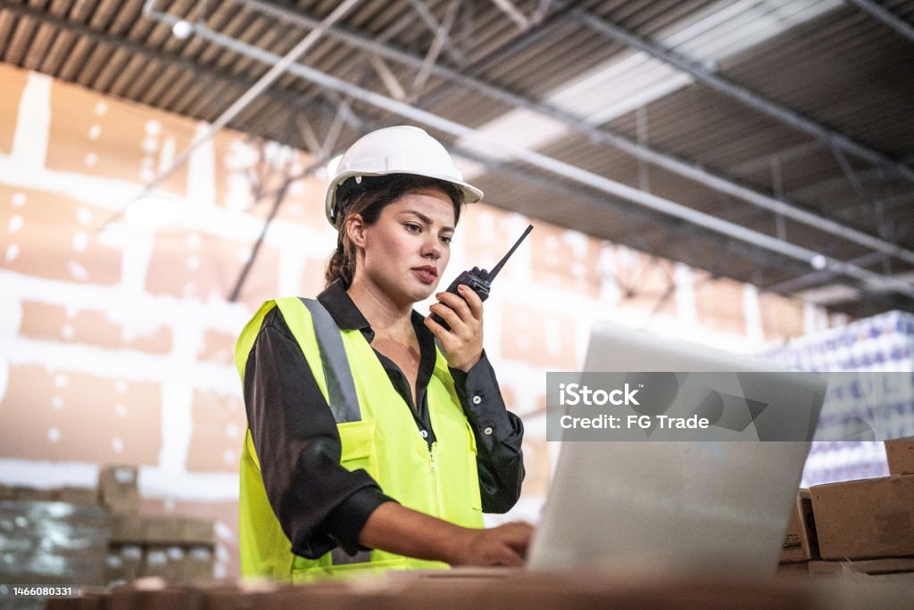 Mechanic checks car undercarriage in GMG-compliant noise-controlled workshop