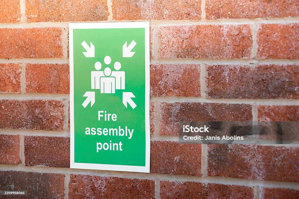 Mechanic responsibly refilling fluids, mindful of GMG's hazardous material protocols