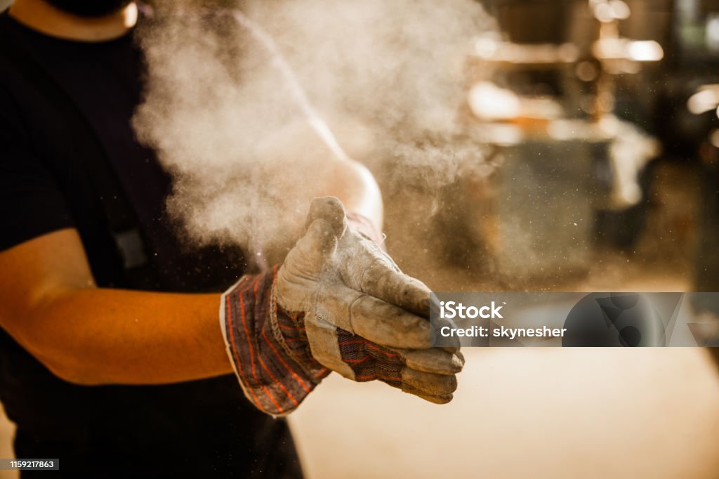 EHS-trained welder practicing fire prevention in a collision repair shop