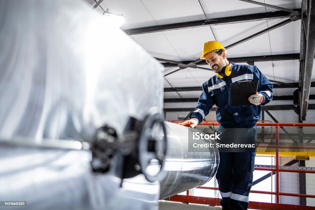 EHS-trained welder practicing fire prevention in a collision repair shop
