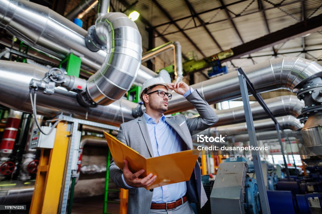 Technician in a mask smiles, breathing easy with GMG’s air quality standards