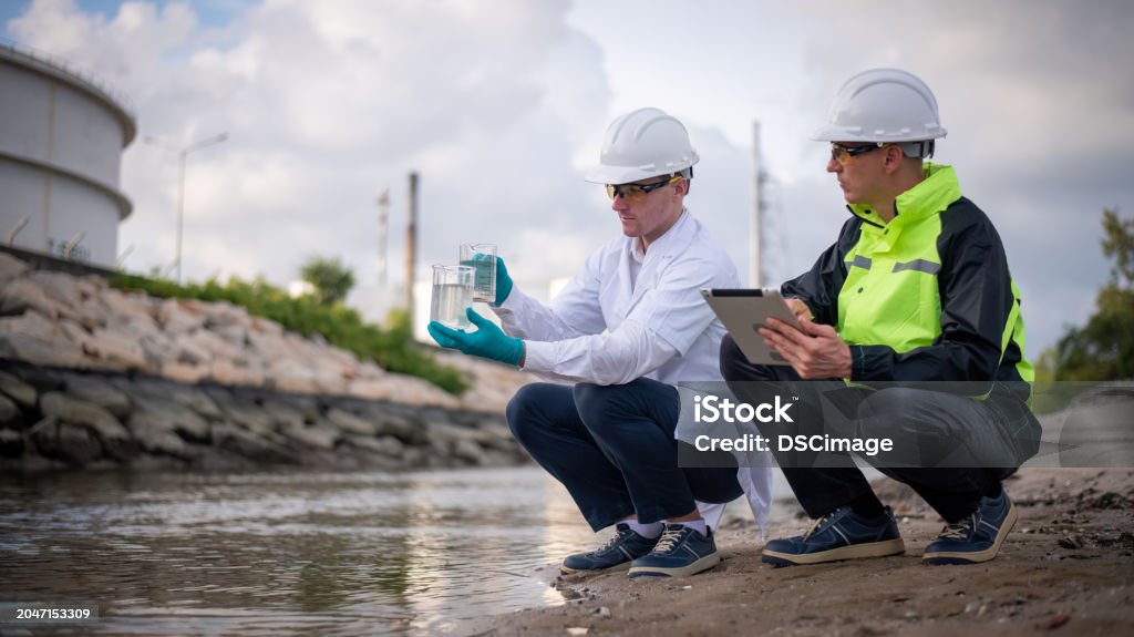 Technician in a mask smiles, breathing easy with GMG’s air quality standards