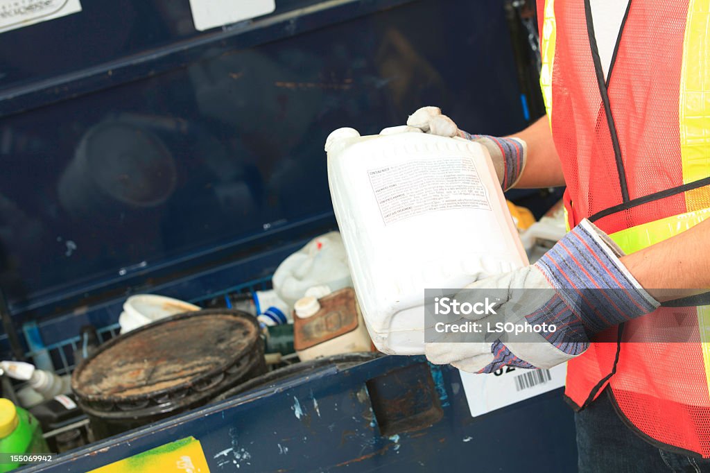 Technician in a mask smiles, breathing easy with GMG’s air quality standards