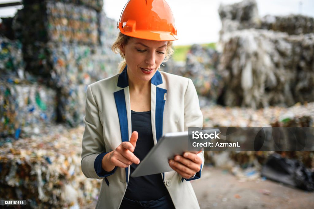Technician in a mask smiles, breathing easy with GMG’s air quality standards