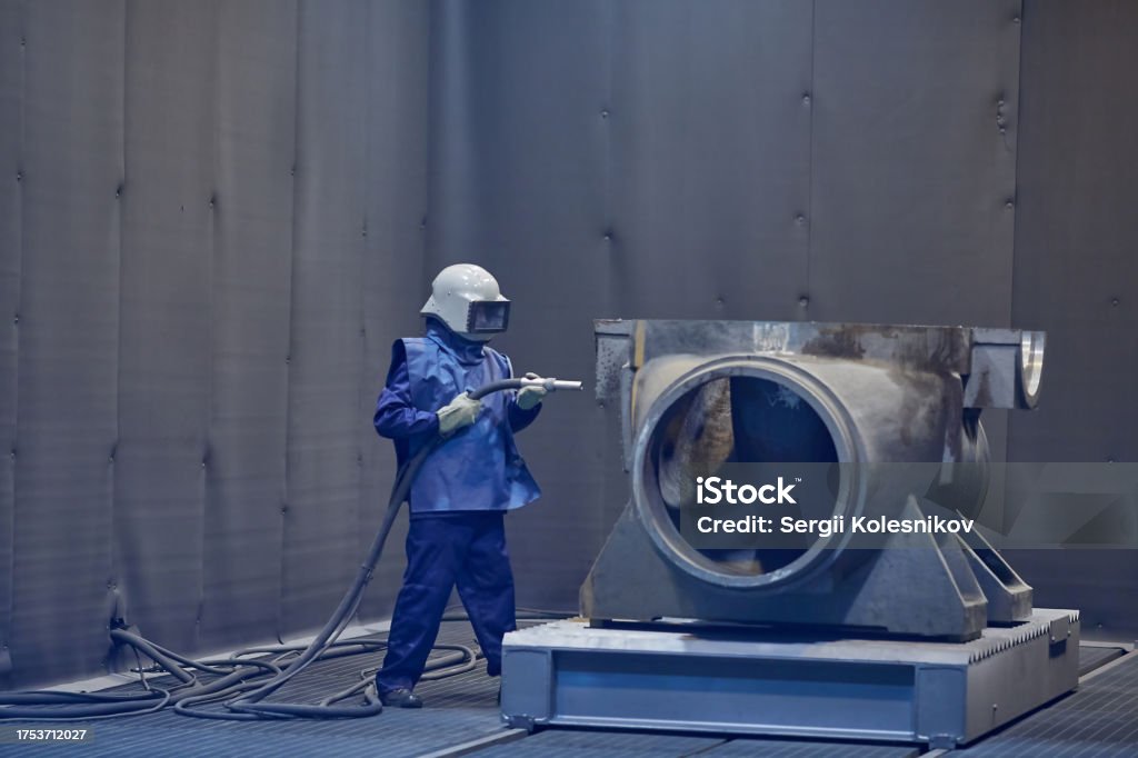 Technician in a mask smiles, breathing easy with GMG’s air quality standards