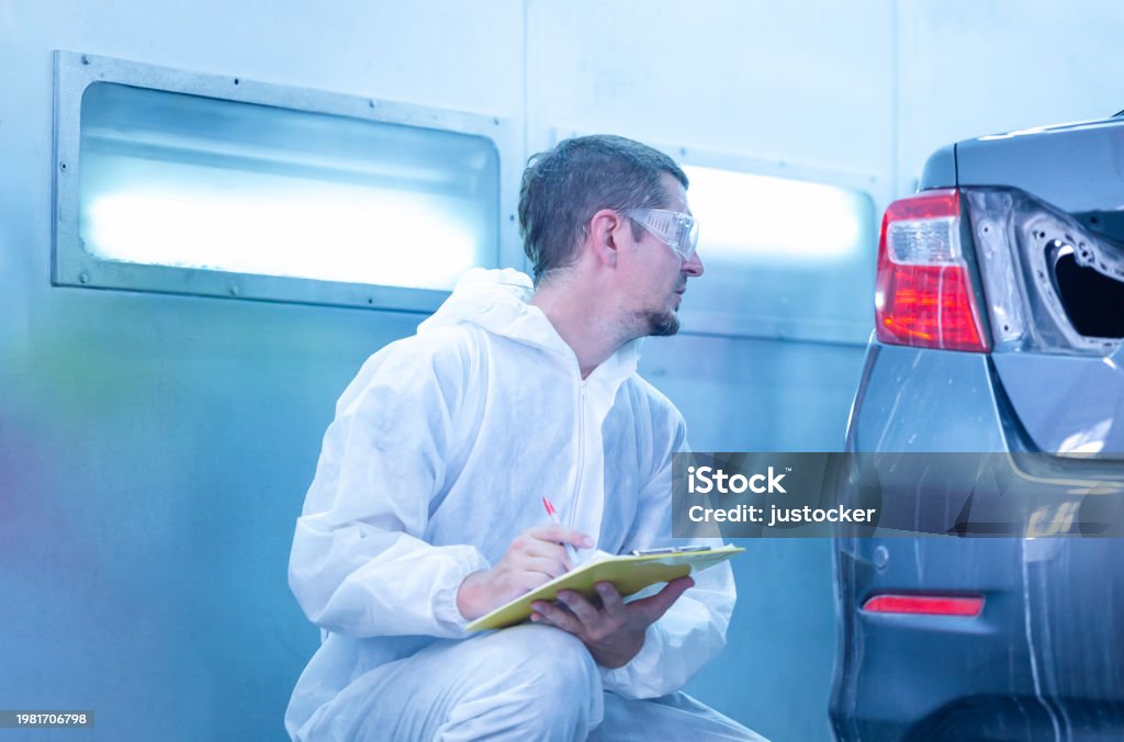 Technician in a mask smiles, breathing easy with GMG’s air quality standards