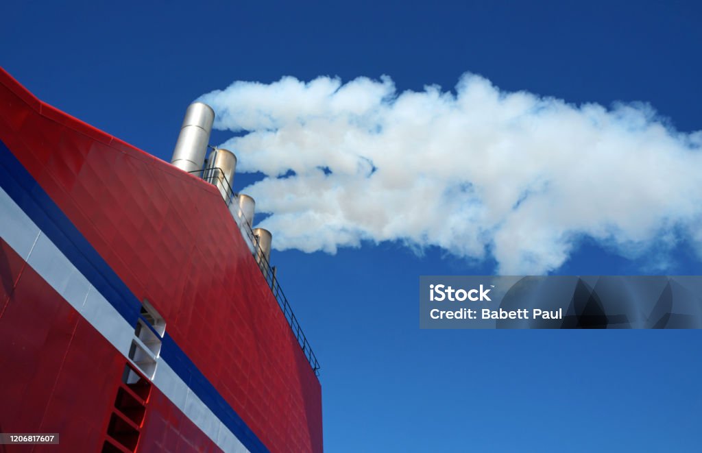 Technician in a mask smiles, breathing easy with GMG’s air quality standards