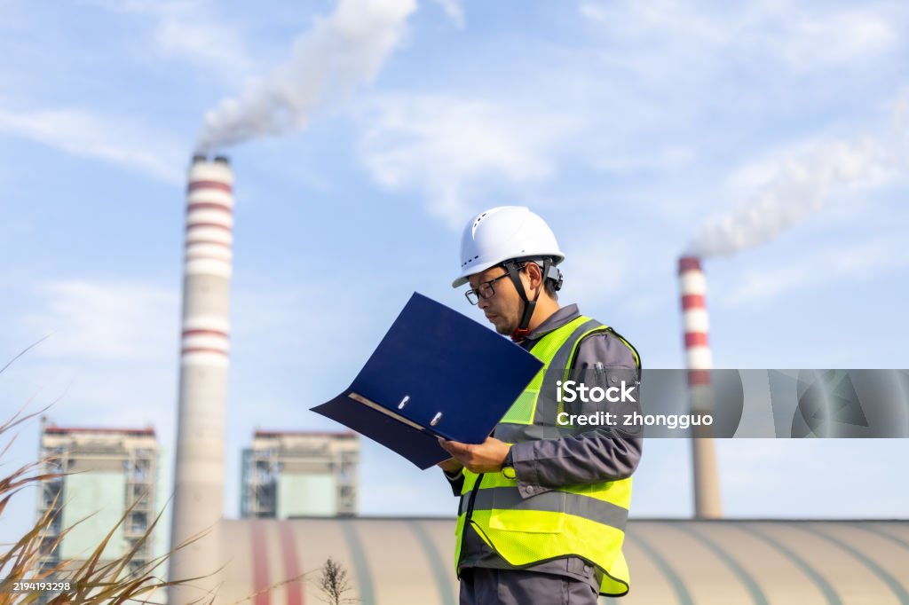 Technician in a mask smiles, breathing easy with GMG’s air quality standards