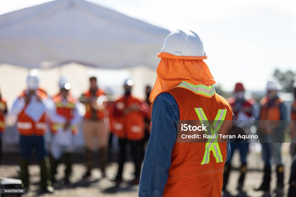 Technician in a mask smiles, breathing easy with GMG’s air quality standards