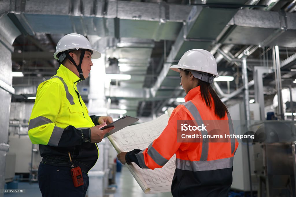 Technician in a mask smiles, breathing easy with GMG’s air quality standards