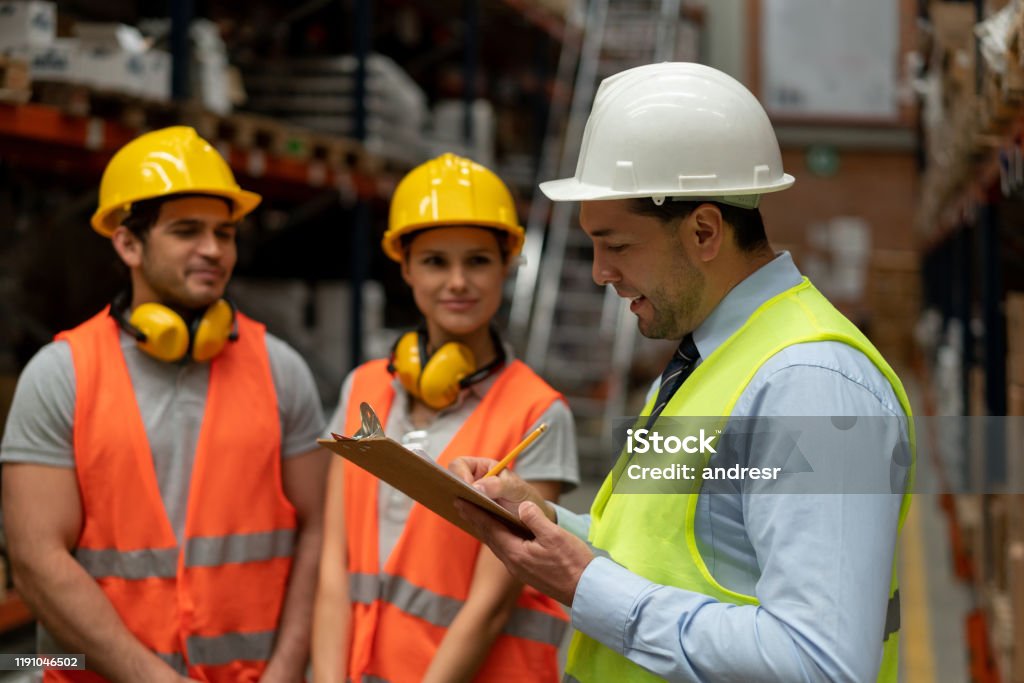 Technician in a mask smiles, breathing easy with GMG’s air quality standards