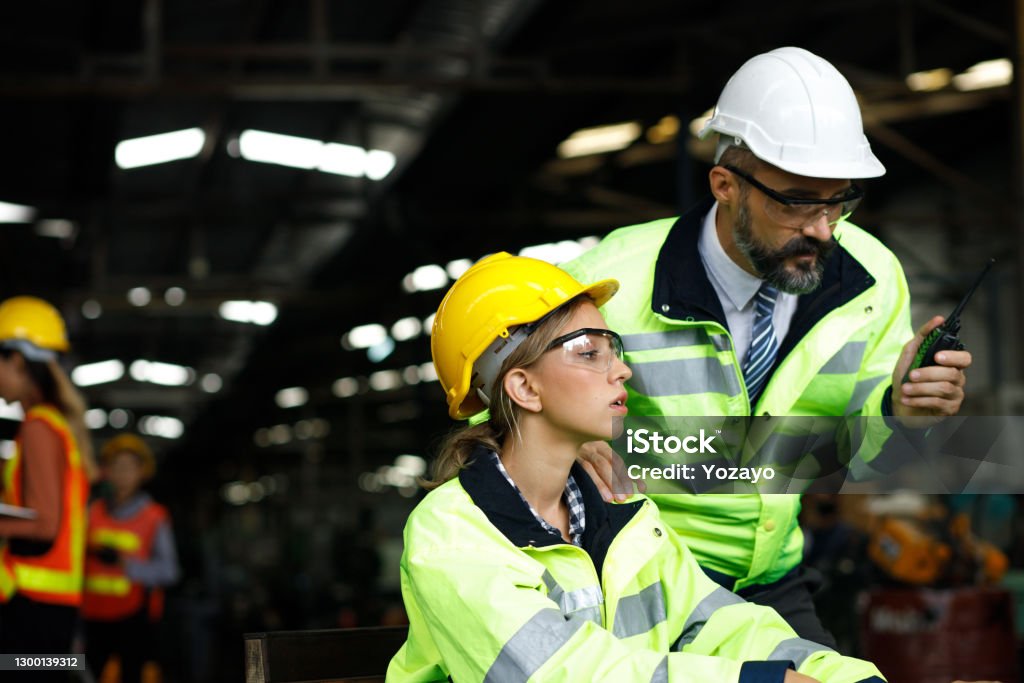 Technician in a mask smiles, breathing easy with GMG’s air quality standards