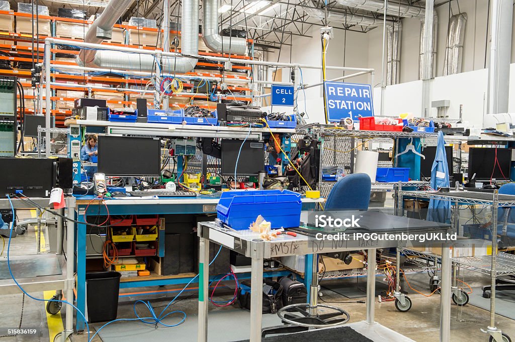 Mechanic checks car undercarriage in GMG-compliant noise-controlled workshop