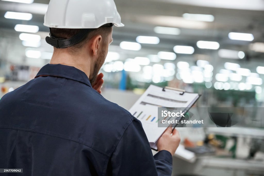 Technician in a mask smiles, breathing easy with GMG’s air quality standards
