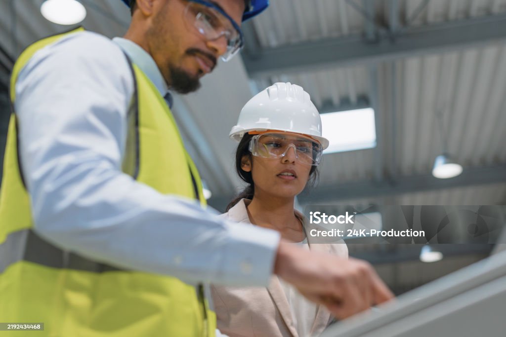 Technician in a mask smiles, breathing easy with GMG’s air quality standards