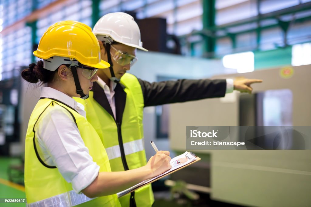 Technician in a mask smiles, breathing easy with GMG’s air quality standards