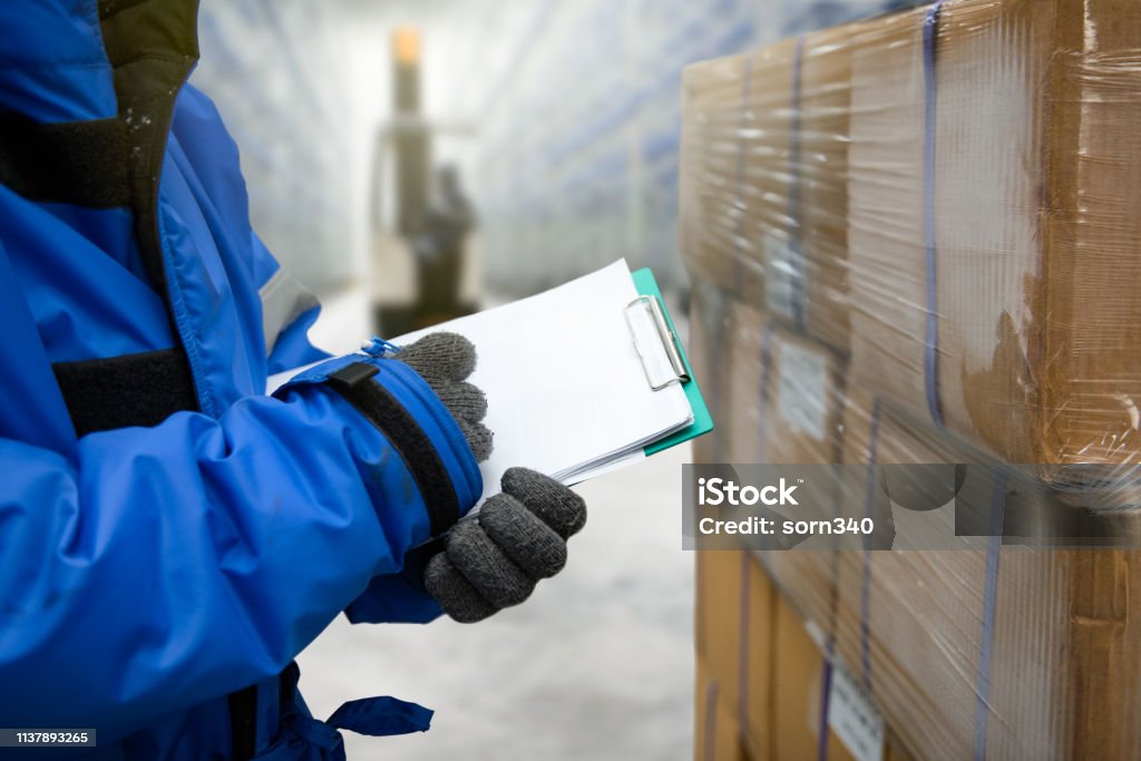 Technician in a mask smiles, breathing easy with GMG’s air quality standards