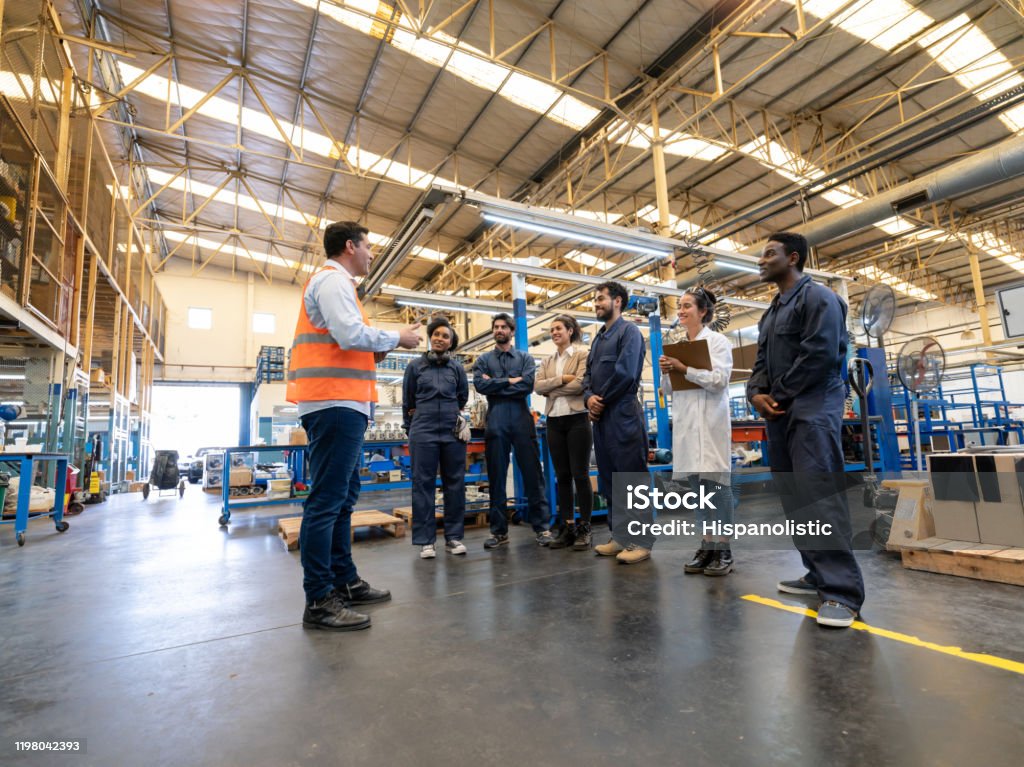 Technician in a mask smiles, breathing easy with GMG’s air quality standards