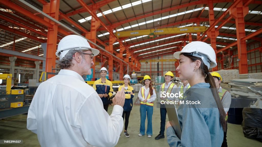 Technician in a mask smiles, breathing easy with GMG’s air quality standards