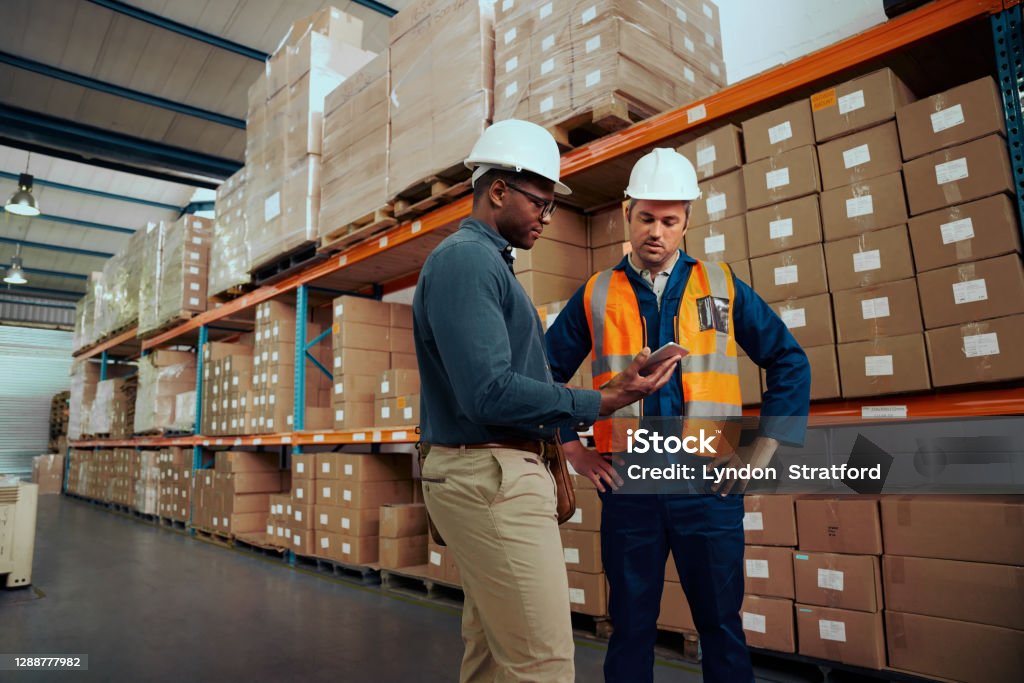 Technician in a mask smiles, breathing easy with GMG’s air quality standards