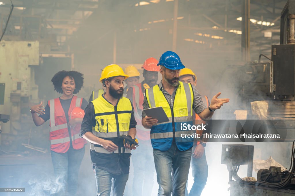 Technician in a mask smiles, breathing easy with GMG’s air quality standards
