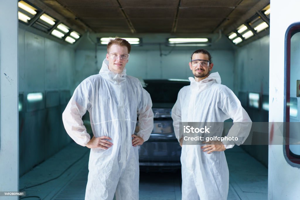 EHS-trained welder practicing fire prevention in a collision repair shop