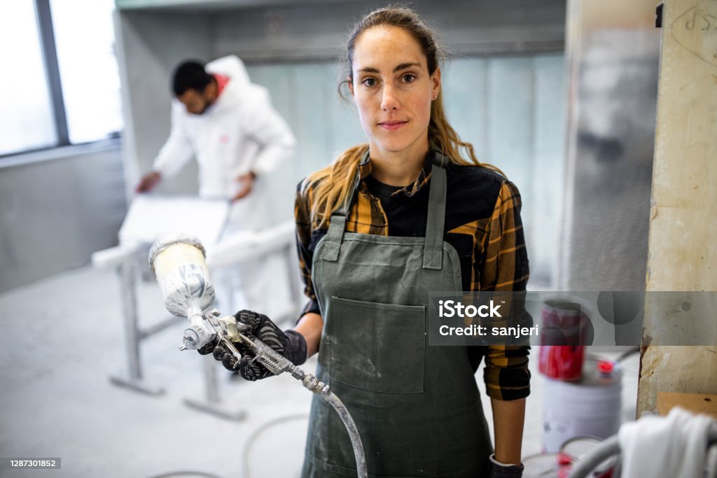 Technician in a mask smiles, breathing easy with GMG’s air quality standards