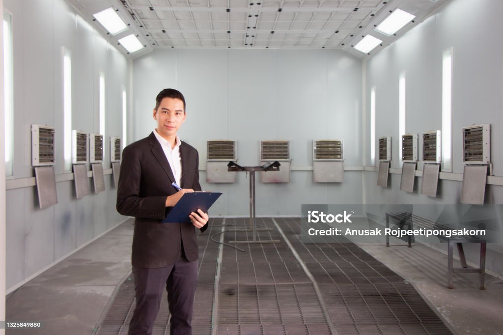 Technician in a mask smiles, breathing easy with GMG’s air quality standards
