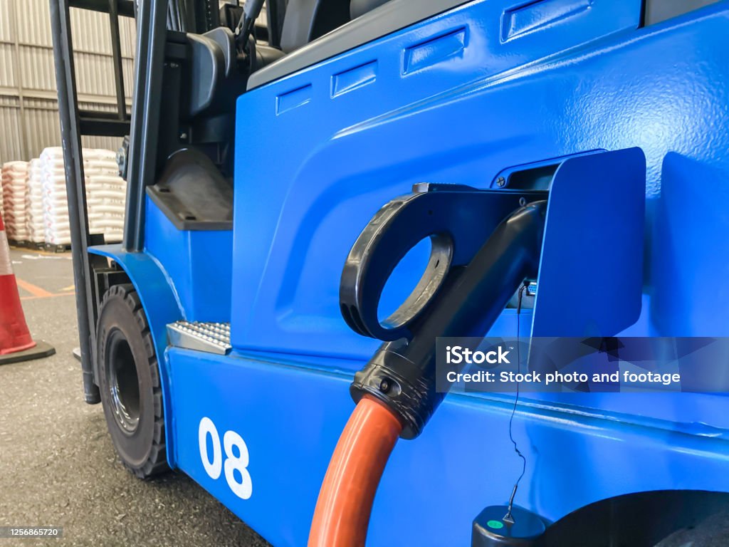 Technician in a mask smiles, breathing easy with GMG’s air quality standards