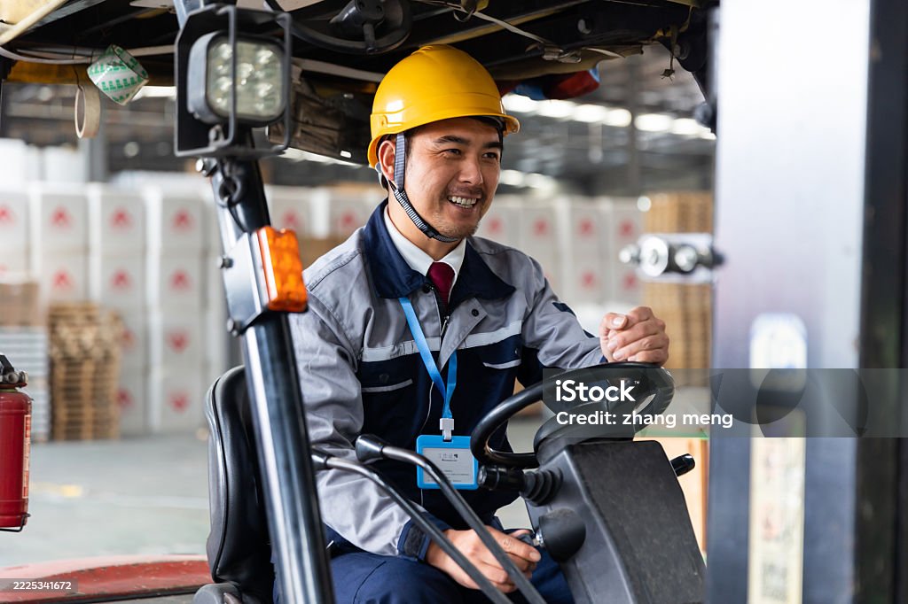 Technician in a mask smiles, breathing easy with GMG’s air quality standards