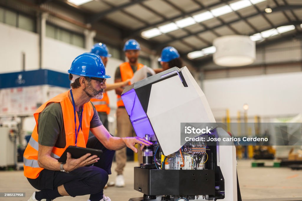 Technician in a mask smiles, breathing easy with GMG’s air quality standards