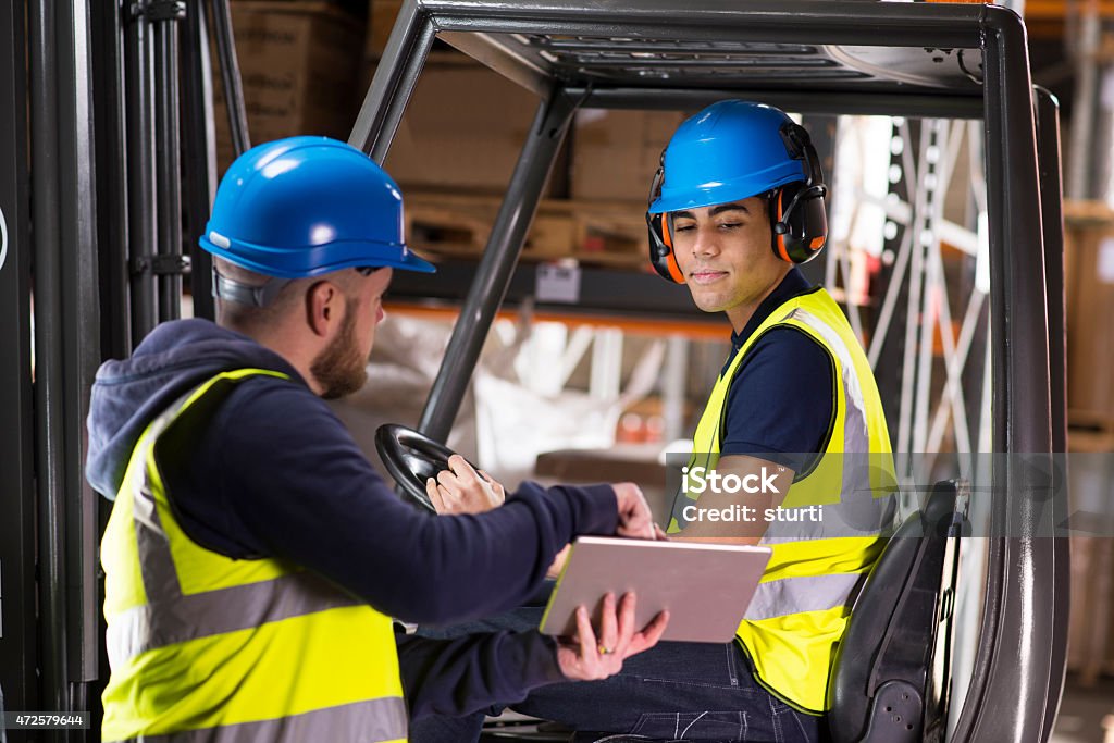 Technician in a mask smiles, breathing easy with GMG’s air quality standards