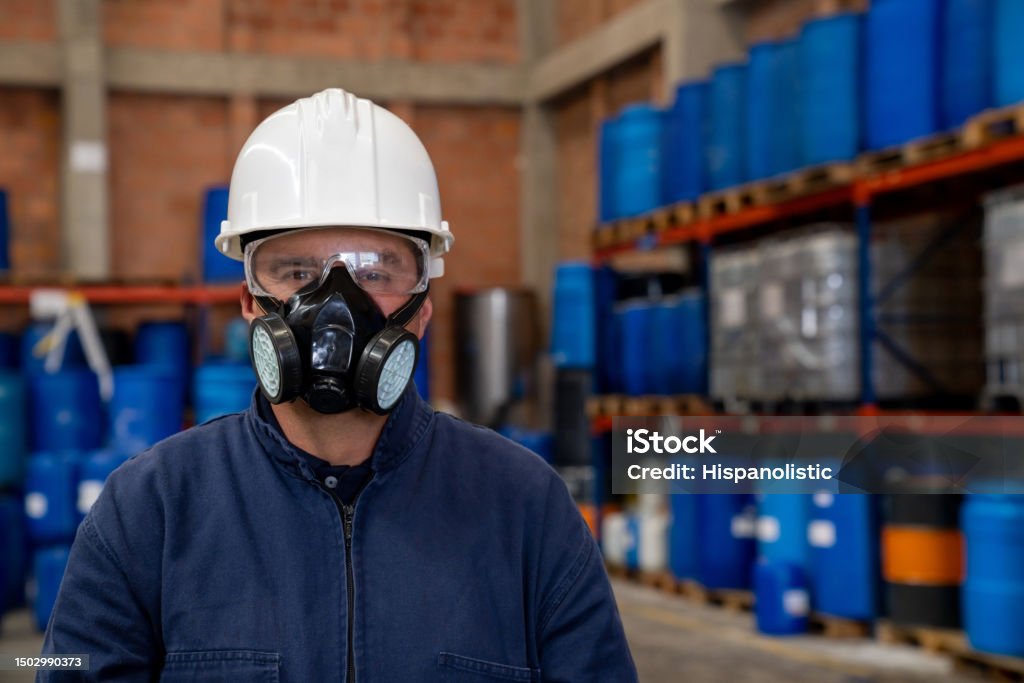 Technician in a mask smiles, breathing easy with GMG’s air quality standards