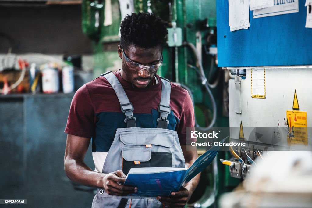 Technician in a mask smiles, breathing easy with GMG’s air quality standards