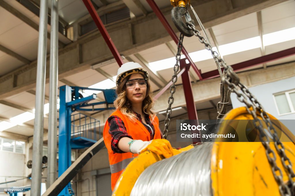 Technician in a mask smiles, breathing easy with GMG’s air quality standards