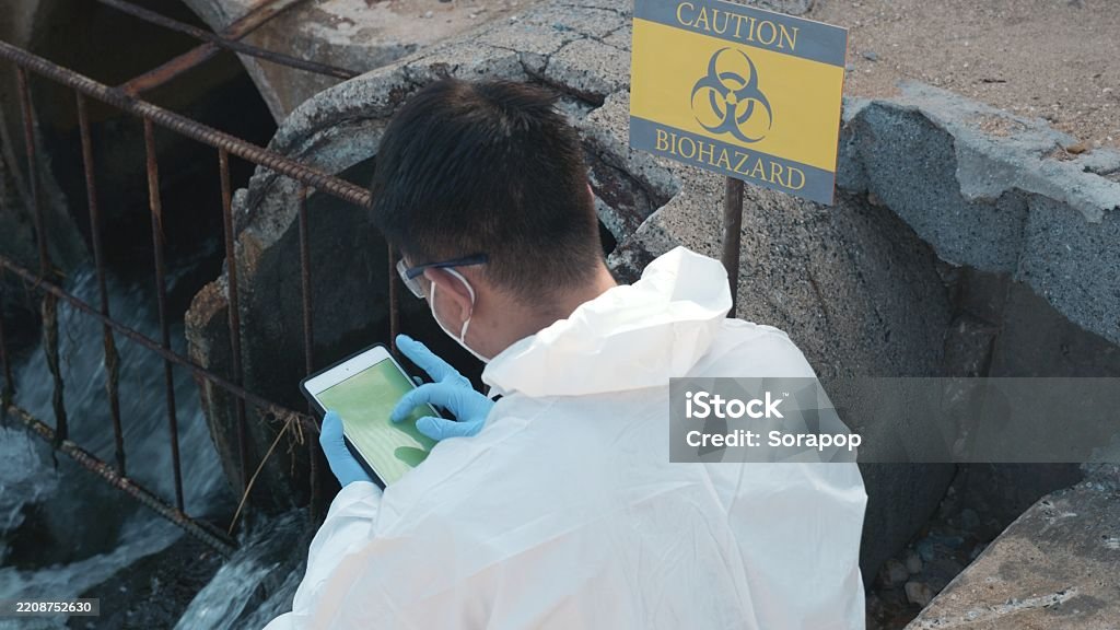 Technician in a mask smiles, breathing easy with GMG’s air quality standards