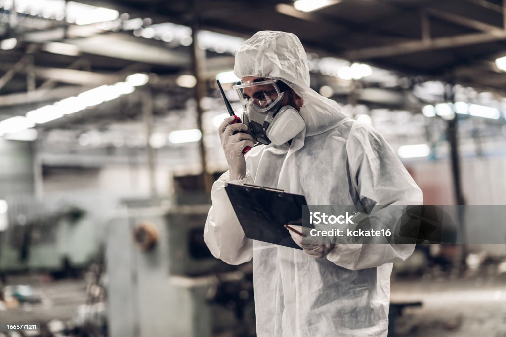 EHS-trained welder practicing fire prevention in a collision repair shop