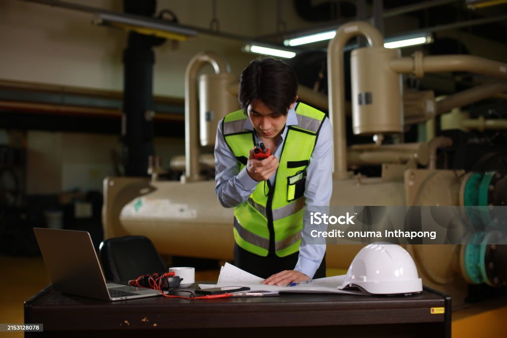 Mechanic checks car undercarriage in GMG-compliant noise-controlled workshop