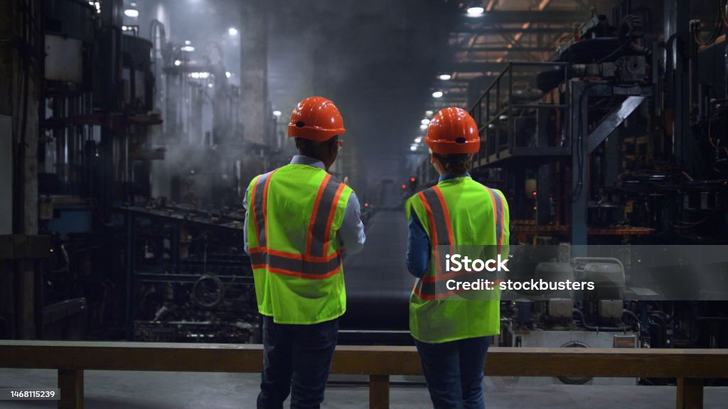 Technician in a mask smiles, breathing easy with GMG’s air quality standards