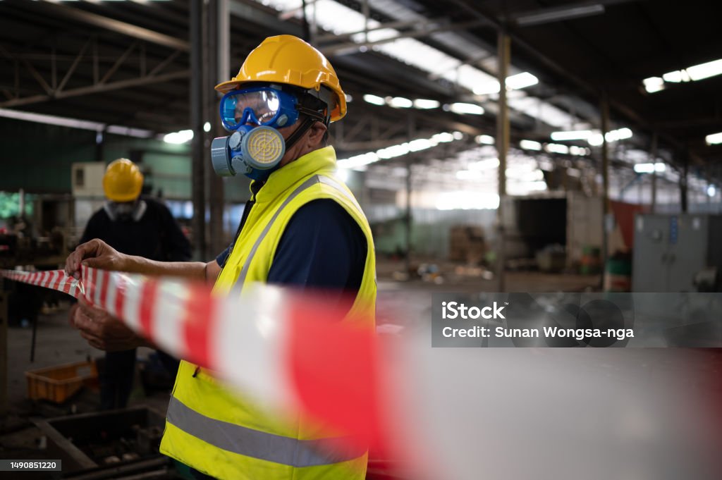 EHS-trained welder practicing fire prevention in a collision repair shop