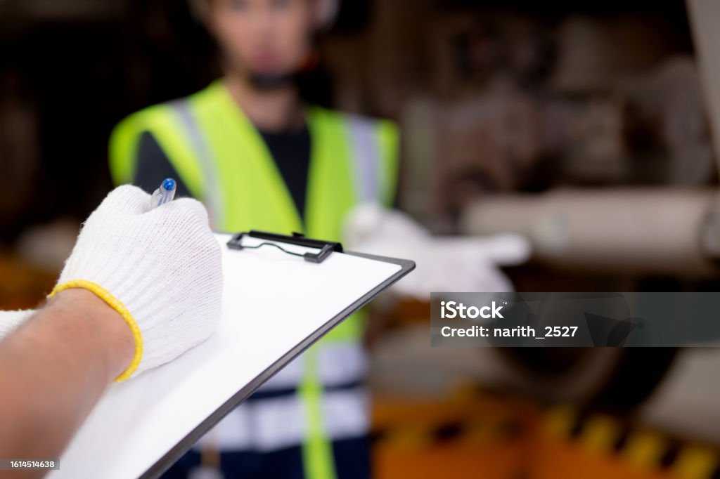 Technician in a mask smiles, breathing easy with GMG’s air quality standards