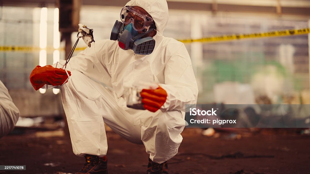 Technician in a mask smiles, breathing easy with GMG’s air quality standards