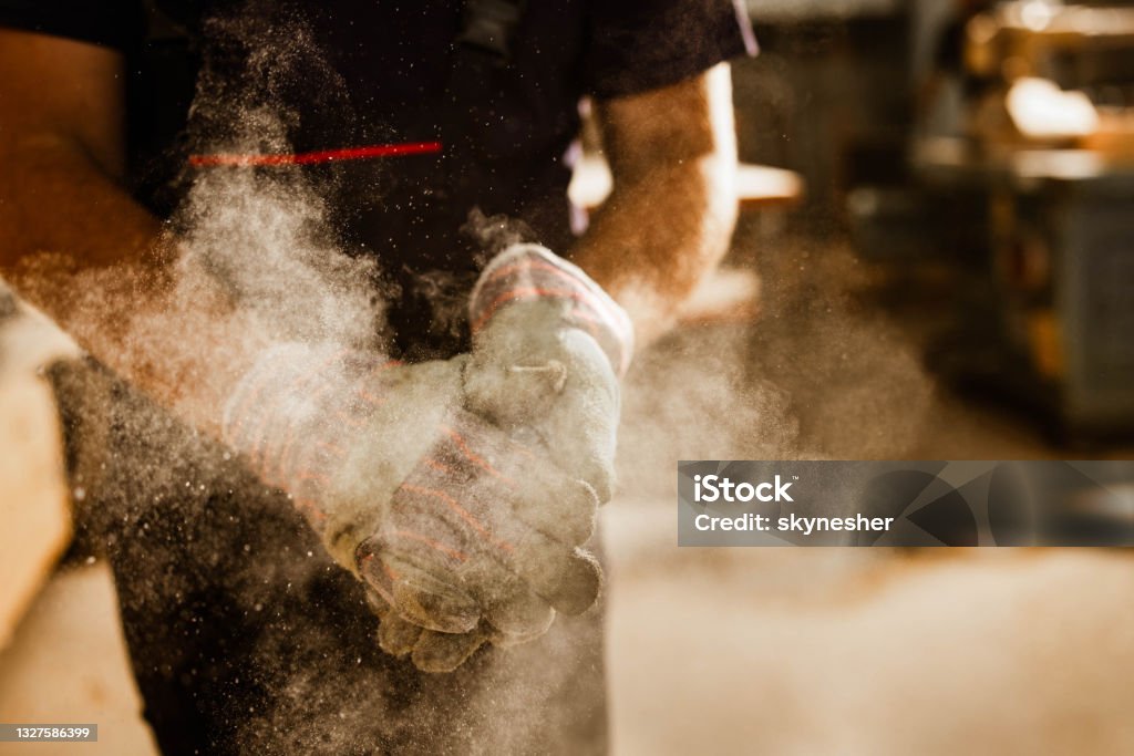 Technician in a mask smiles, breathing easy with GMG’s air quality standards
