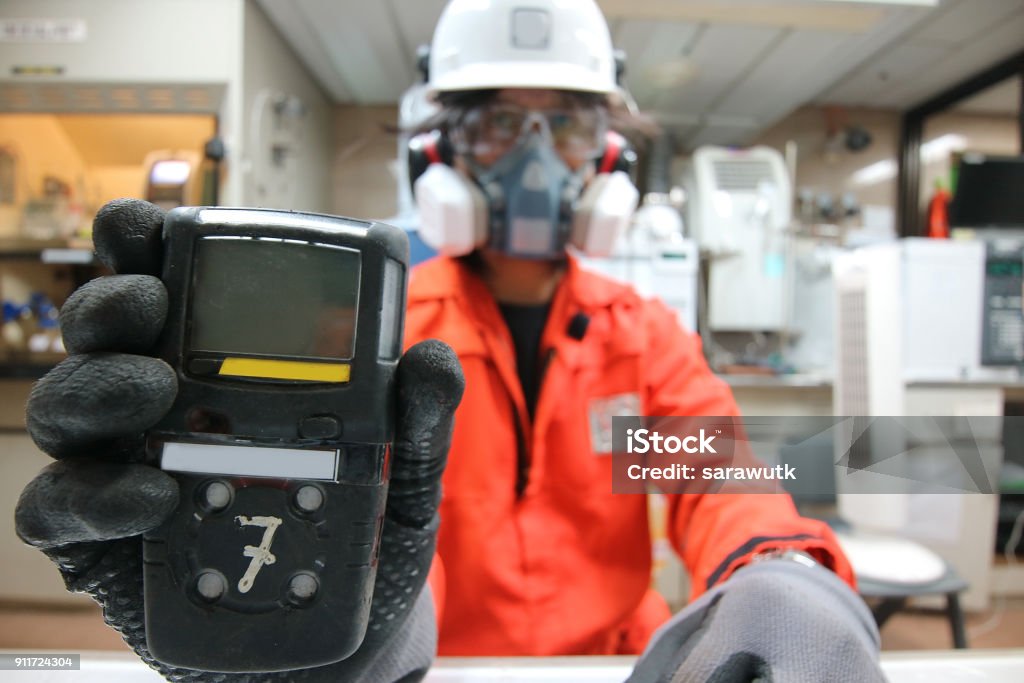 Technician in a mask smiles, breathing easy with GMG’s air quality standards