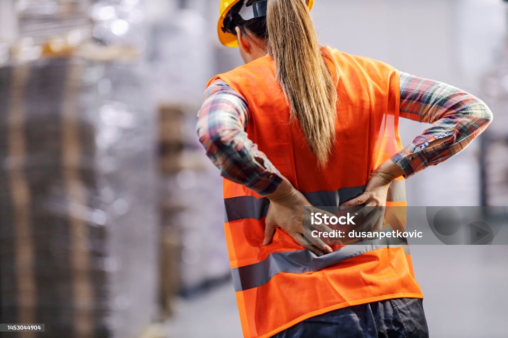 Technician in a mask smiles, breathing easy with GMG’s air quality standards