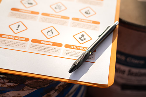 Mechanic checks car undercarriage in GMG-compliant noise-controlled workshop