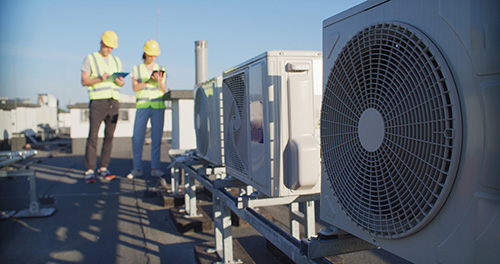 EHS-trained welder practicing fire prevention in a collision repair shop