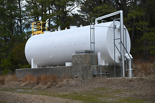 EHS-trained welder practicing fire prevention in a collision repair shop