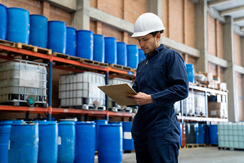 EHS-trained welder practicing fire prevention in a collision repair shop