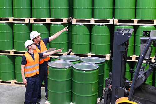 Mechanic checks car undercarriage in GMG-compliant noise-controlled workshop